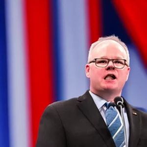 Artistic representation for Harri VP pick Tim Walz rallies Democrats in punchy speech , sidesteps China questions. Let me know what you think is a suitable title for the article.